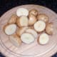 Washed and halved potatoes