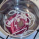 Onion and seasonings are added to ox cheek