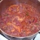 Spicy beef is brought to a simmer