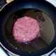 Starting to fry wild boar and apple burger