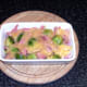 Cheese melted over ham and sprouts