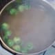 Sprouts added to simmering stock and potatoes