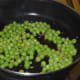 Step five: Throw in green peas. Also, add some salt. Stir-cook for about 4 minutes, adding very little water. Turn off the heat. Collect green peas in a bowl.