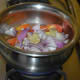 Step two: Boil chopped tomatoes, onions, and ginger, adding some water, till tomatoes become soft.
