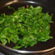 Starting to stir-cook the leaves.