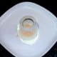 A small drinking glass is used as a templet for trimming the fried egg