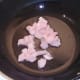 Chicken is added to hot wok