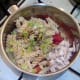 Pasta, chicken and celtuce are added to tomato sauce