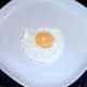 Fried egg is lifted to a plate