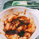 In a large bowl, marinate the chicken pieces.