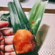 Insert the chicken in the middle of the leaf.