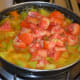 Step four: Add chopped tomatoes. Stir once. Continue cooking, covered, for another 5 to 6 minutes. Stir the mix occasionally.