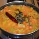 Step six: Add tempering to the curry as per instructions.
