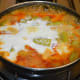 Step five: Add beaten curd. Mix well. Add remaining salt. Bring the mix to a gentle boil. Next, turn off the heat.