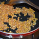 Sauté split chickpea (gram dal) and white lentil (urad dal) in oil until they get lightly golden brown.