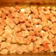 Place the cubes of beef on a baking sheet or in a large roasting pan, being sure they aren't too crowded.