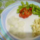 Slice the onion, garlic, bell pepper, and green chilies