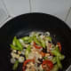 Add the chilies and bell pepper