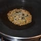Step two: Heat oil in a deep-bottomed pan. Throw in cumin seeds. Let them crackle.