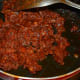 Saute until the mixture shows a bit of oil on the edges and leaves the bottom. Turn off the heat.