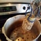 Step Fourteen: Add your jars to your pressure canner. The canner will need 3 quarts of water to process your jars.