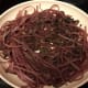 Skillet with red wine, pho pasta, and mushrooms
