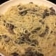 Skillet full of drunken mushroom spaghetti