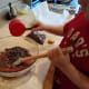 Step Seven: Fold in the chocolate chips, leaving a handful for topping the brownies.