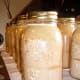 These jars were processed at 15 lbs. pressure, which I had been advised was correct for my elevation. It was too much, and actually blew the milk apart into liquids and solids, creating a cottage cheese texture.
