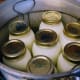 Seven quart jars ready to be processed. Note the wire rack in the bottom of the canner, which holds the jars off the bottom, so they don't break.