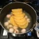Step 1: Combine together the can of pineapple and the can of lychee in a large saucepan.