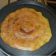 Flip it once the bottom turns golden brown. Add a few drops of oil on the other side.