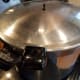 Place the lid on the canner. Your lid should have instructions for making this easy.