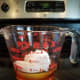 Heat your coconut oil and honey together in the microwave, and then mix then into your water.