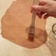 Brush your dough lightly with water.