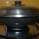 Keep the heat medium-low. Add a few drops of oil on the top. Cover the pan, and cook for about 10 minutes or until the bottom part becomes golden brown and crispy. Check it often to ensure the not burning of handvo in the bottom.