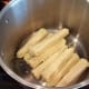 Place corn cobs in the bottom of your pot.