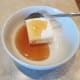 While baking, make your cinnamon roll icing with honey and cream cheese.