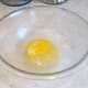Add an egg to your mixing bowl.