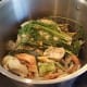 I started my dumping all of my veggies in the bottom of the pot and filing it to the brim with water.