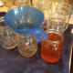 Fill all of your jars to the bottom of the neck. Most of the liquid can be removed without straining.