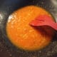 Fry the paste in a wok.