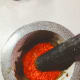 Pound the shallots, onion, garlic, and shrimp paste. Combine into a uniform paste.