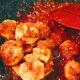 The sambal thickens as it cooks.