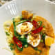 Garnish the top with the scallions, hard-boiled eggs, fried onions, and green chilies.
