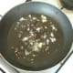 Grated garlic is gently sauteed in olive oil with dried sage, slat and pepper