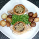 Sauteed mushroom stems and garlic are stuffed in to mushroom cups