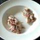 Meat is plucked from chicken thigh bone