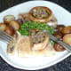 Tucking in to fried pork fillets and stuffed garlic mushrooms