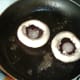 Mushroom cups are added to frying pan